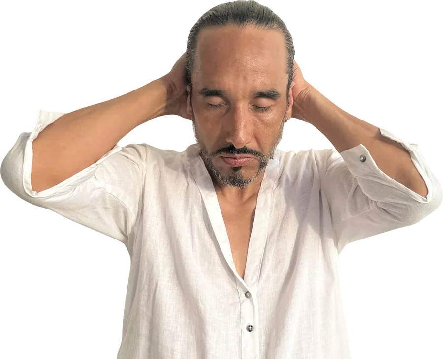 Librarian Joséf Sánchez Coach listening with his hands on his head